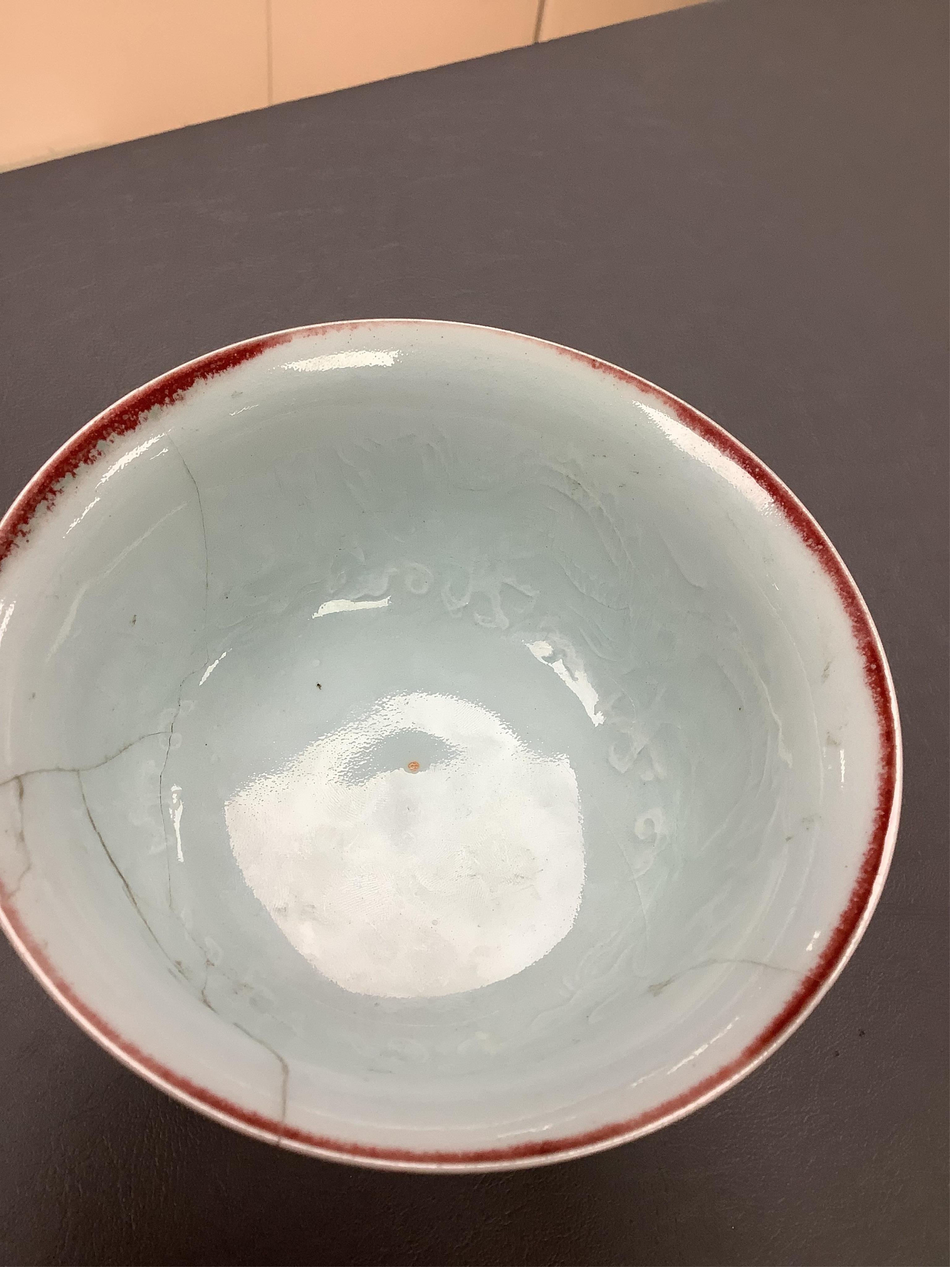An early 20th century Chinese famille rose teapot, later famille rose teabowl, sang de boeuf stem bowl and two others, tallest 11cm. Condition - varies